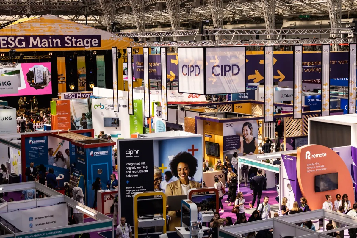 CIPD exhibition hall at Excel London, stands and the main stage in view.