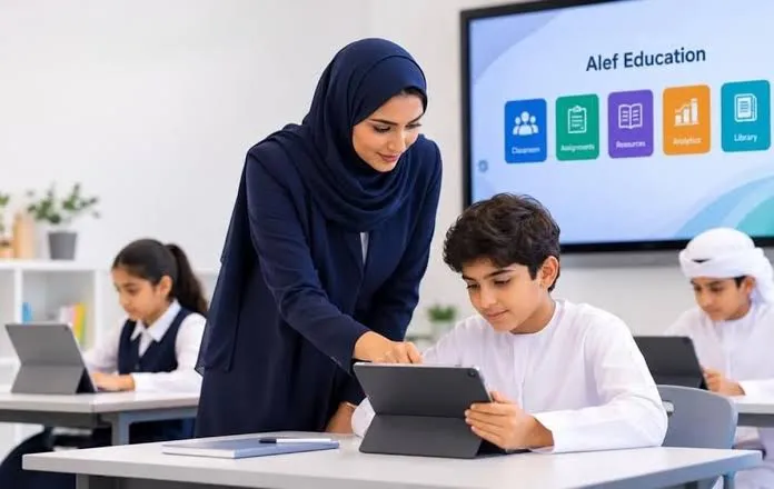 Teacher guiding a student using a tablet in a modern classroom